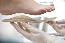 Removable orthopedic insoles for nurses shoes