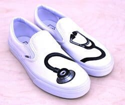 A stethoscope painted on some Vans nurses shoes