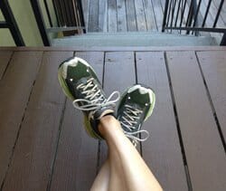 A woman wearing old running shoes for flat feet