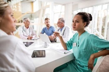 Nurses discussing at the table