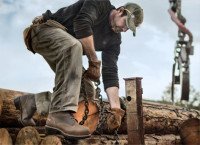 A man wearing Timberland pitboss boots at work