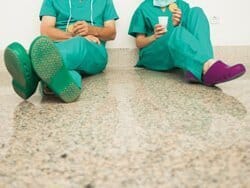 Two nurses sat taking a break