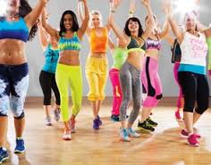 Females wearing vibrant clothes for Zumba