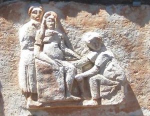 roman birthing chair and midwife